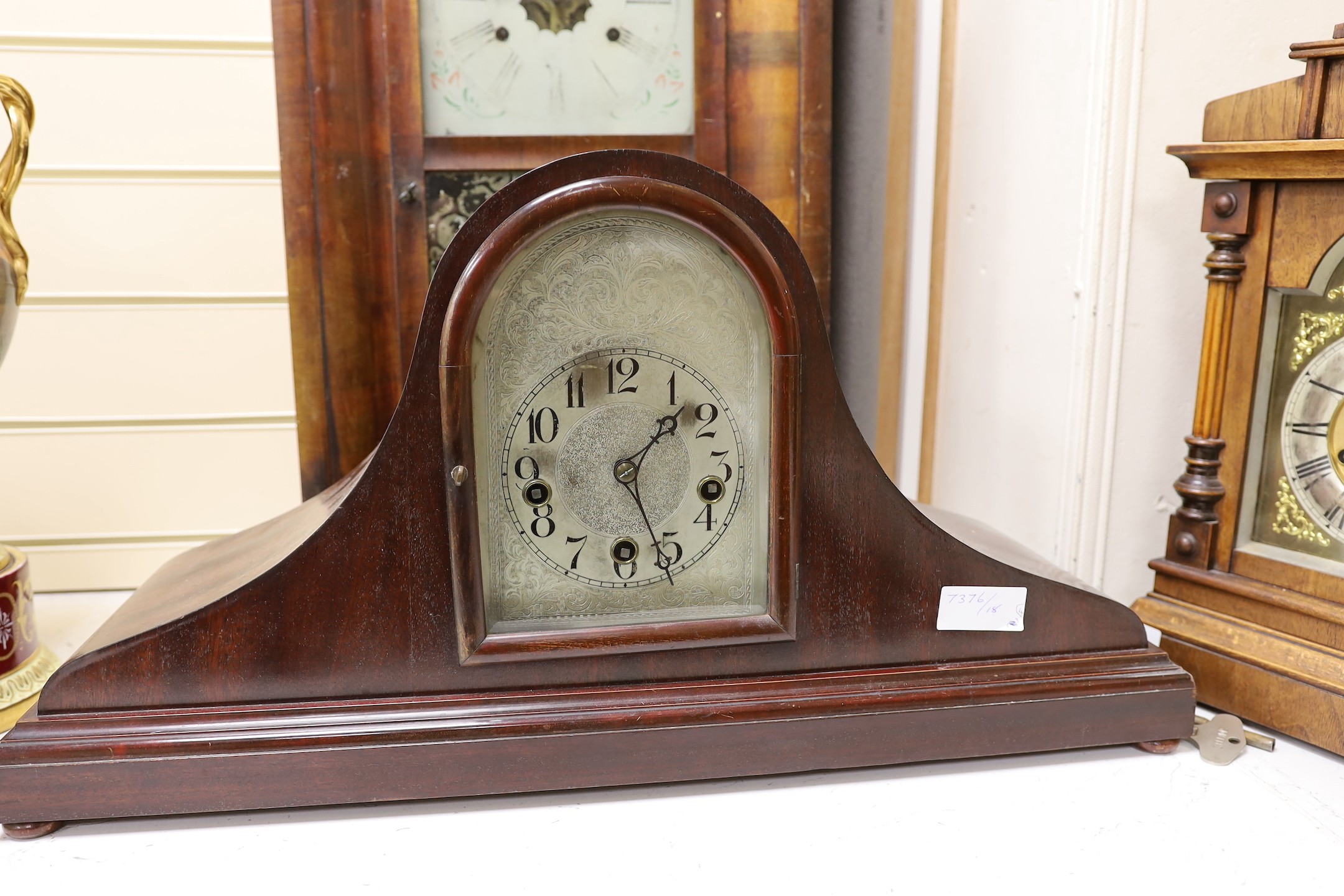 Two domed mantel clocks, a Connecticut shelf clock and a Black Forest mantel clock